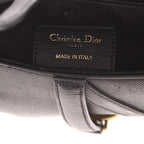 Christian Dior Saddle Bag black leather — bottom view with D clasp